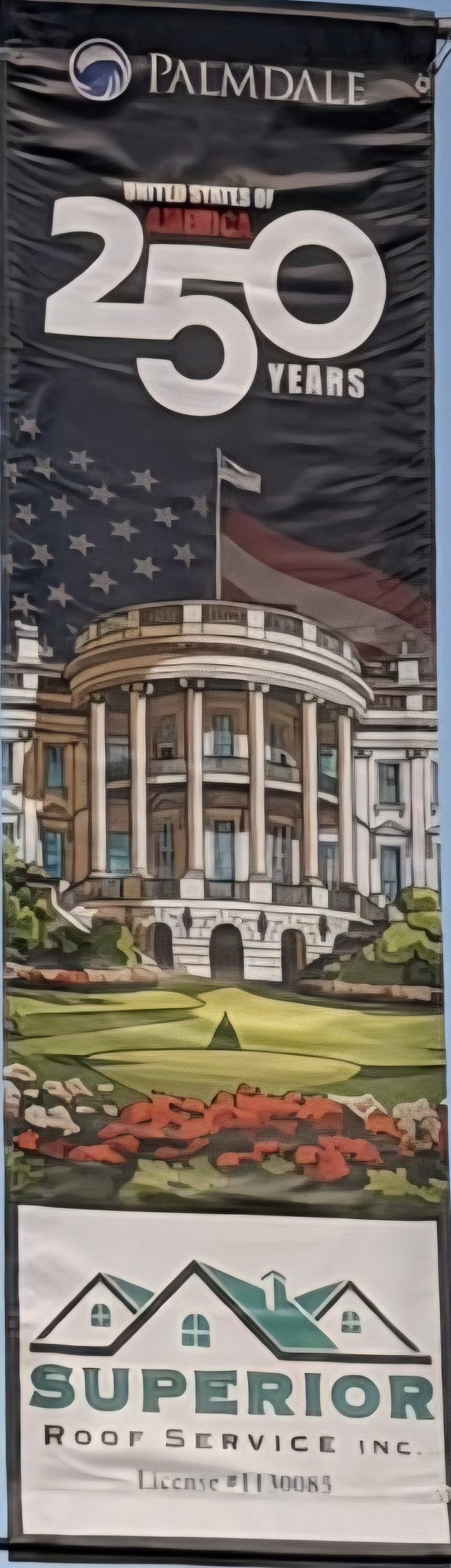 Palmdale America 250 banner with the White House and the Superior Roof Service logo