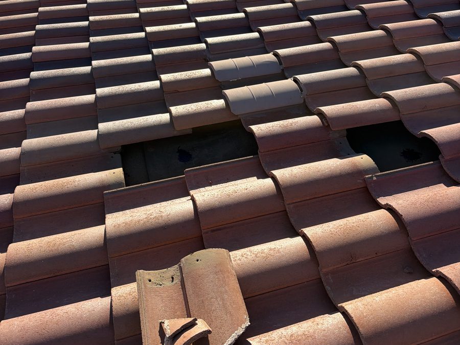 Clay tile roof opened up for repair