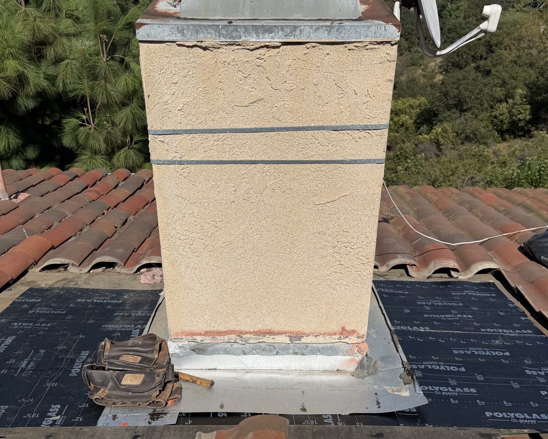 New flashing at a chimney over underlayment