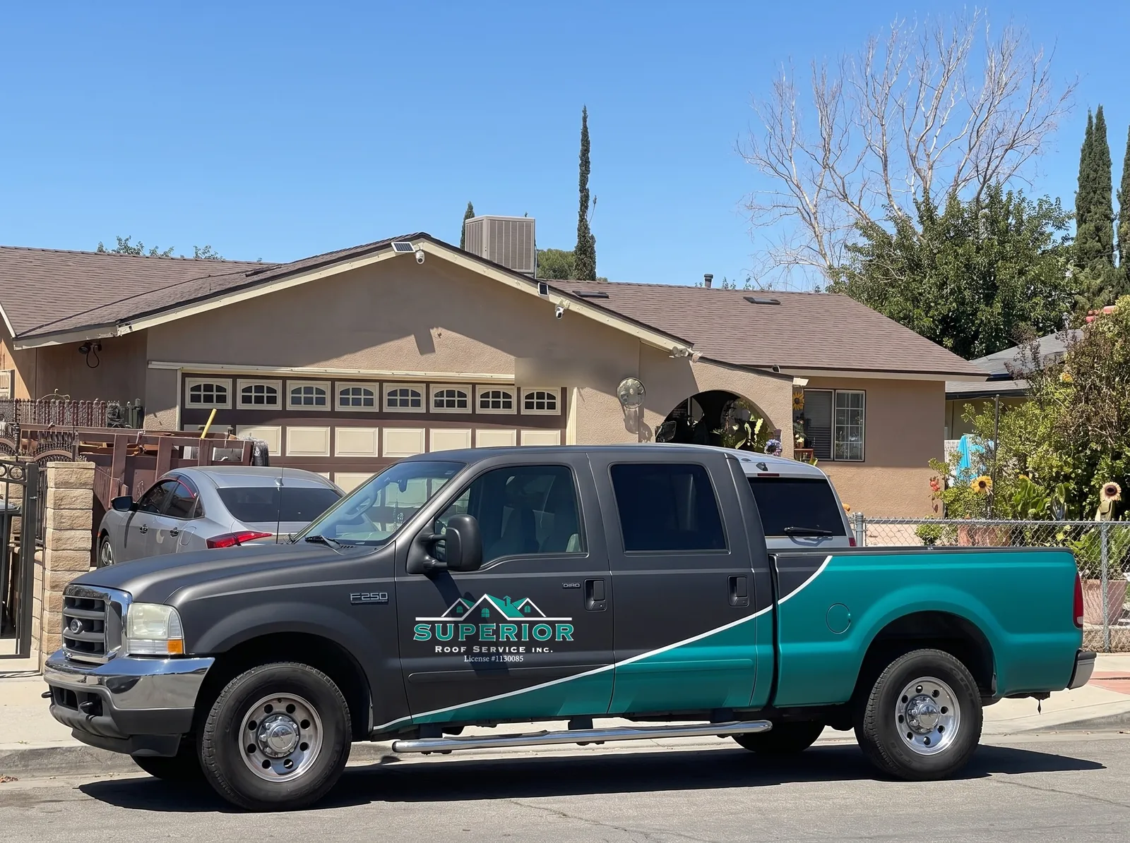Superior Roof Service truck in the company colours parked on a residential street